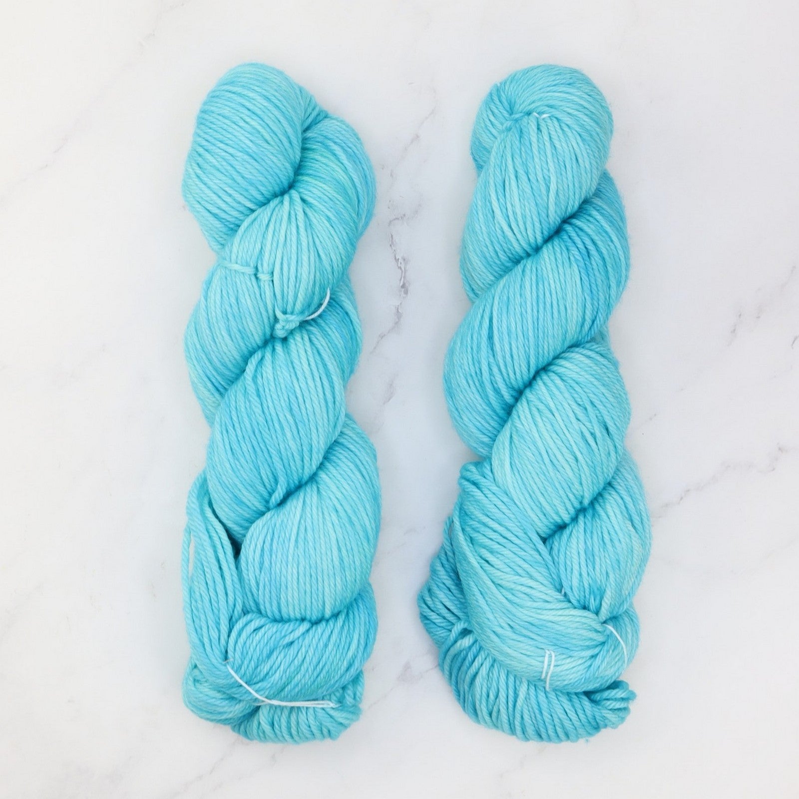 Fiori DK IV in colourway Aquamarine – 8ply weight merino yarn