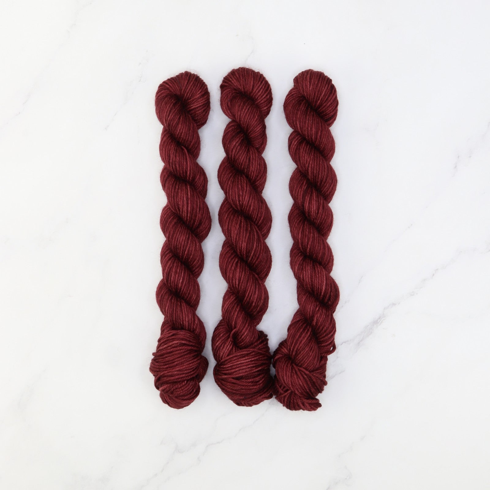 Skein Sisters Fabulous Sock Minis 20g/80m in colourway Burgundy – 4ply weight merino, nylon yarn