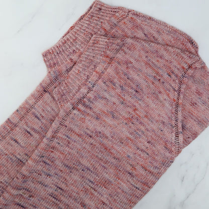 Outline Tee laid flat, showing the dropped-stitch edges and twisted rib, in Skein Sisters Fabulous Sock