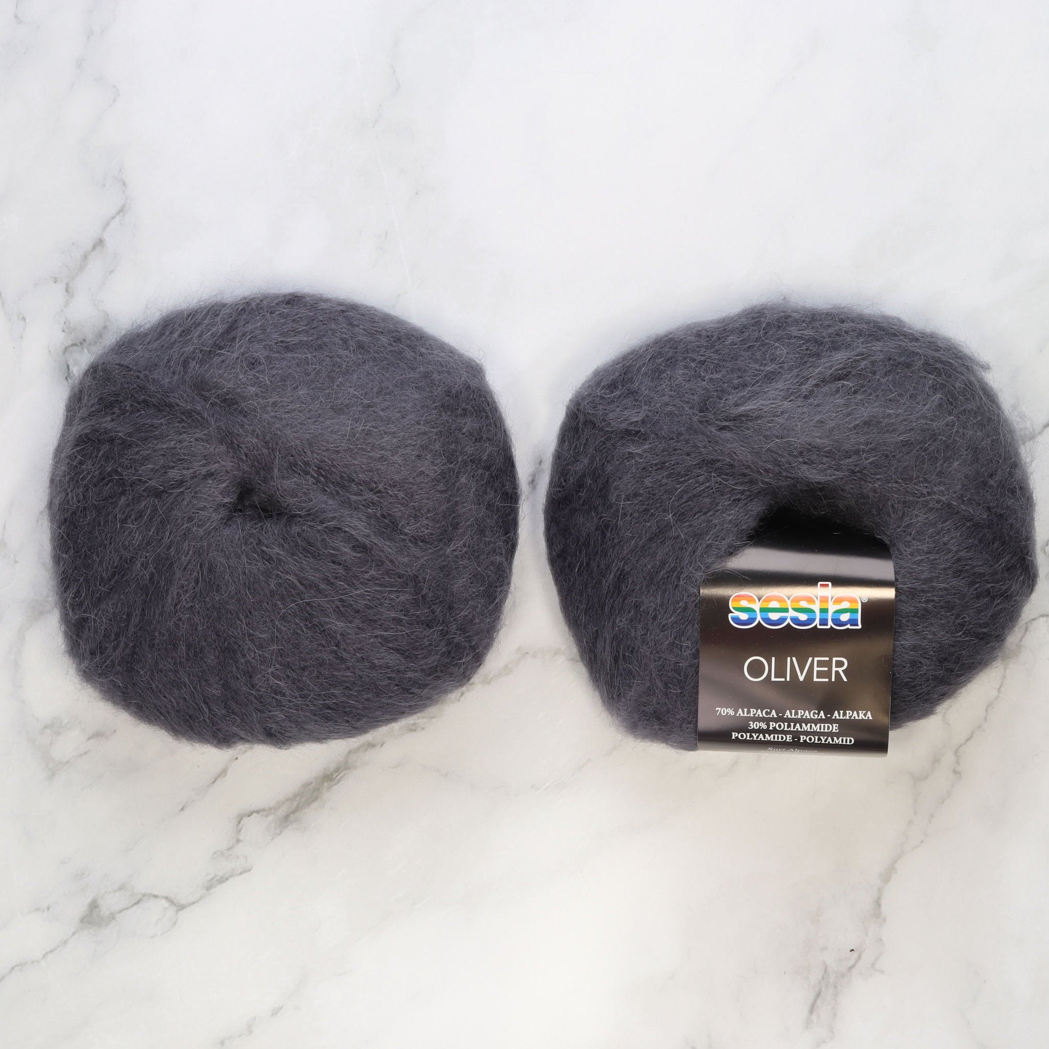 Sesia Oliver in colourway Dusky Purple – 2ply weight alpaca, nylon yarn