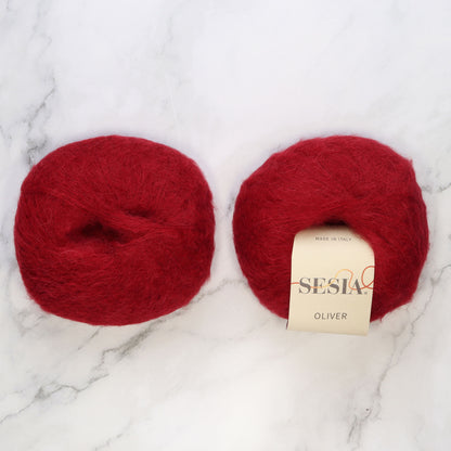 Sesia Oliver in colourway Dark Red – 2ply weight alpaca, nylon yarn