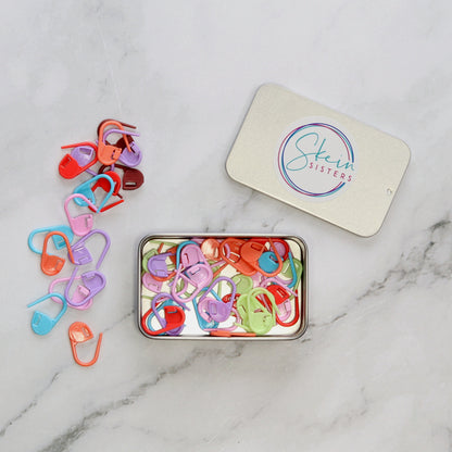 by Skein Sisters Stitch Marker Caddy – tin open with markers