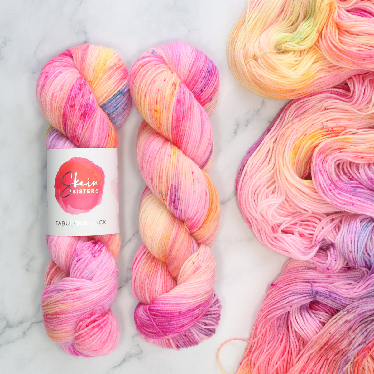 Skein Sisters Fabulous Sock in Unbreakable – a variegated pink with blue and yellow, hand dyed in Sydney