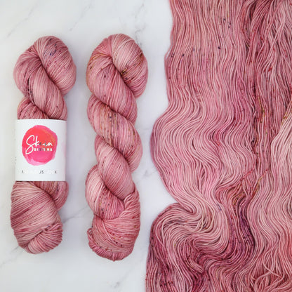 Skein Sisters Fabulous Sock in You Make Me Blush, the yarn for the Outline Tee Kit
