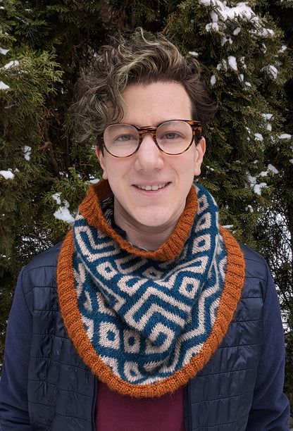 Xandy Peters, knitwear designer and teacher, wearing a colourwork cowl