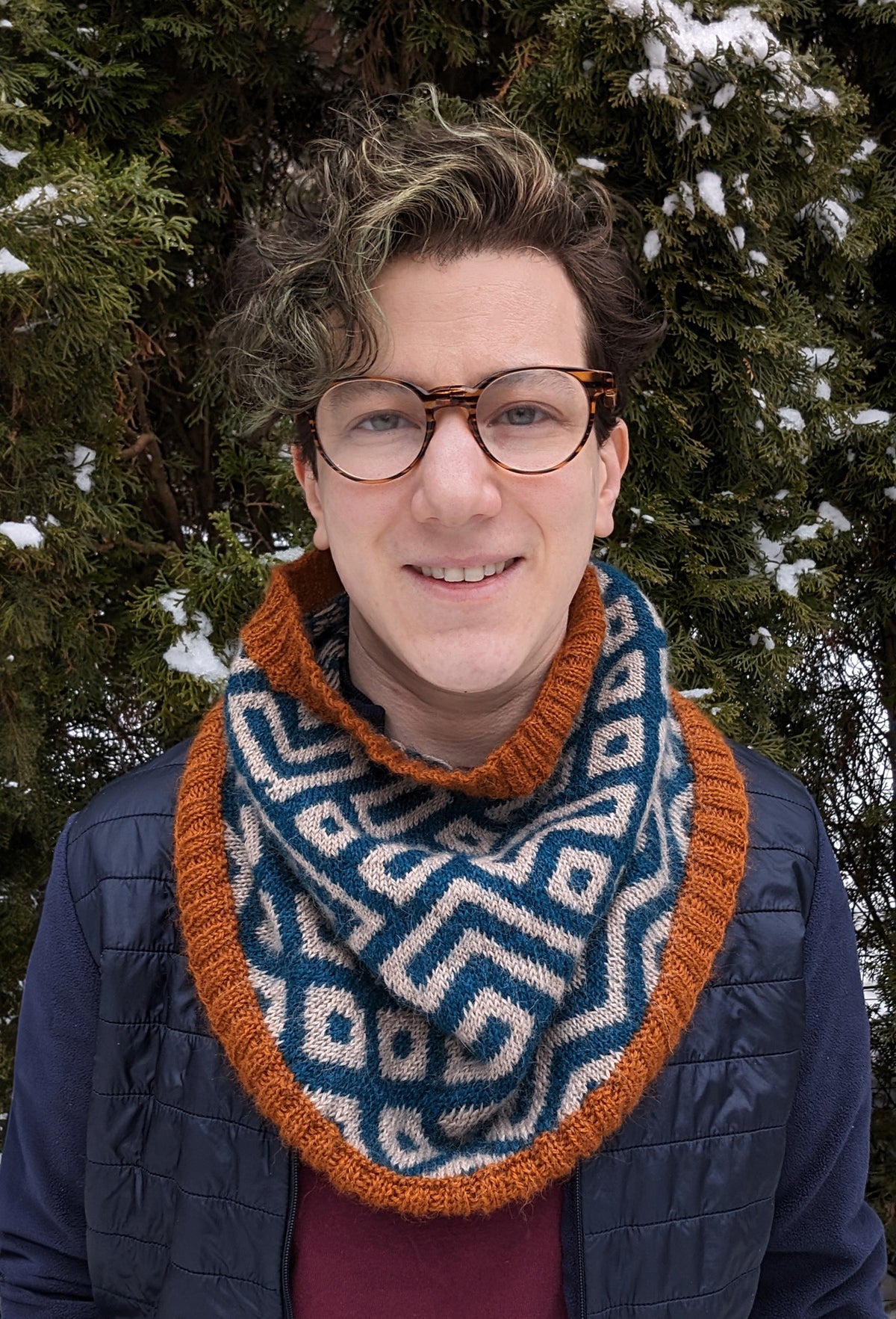 Xandy Peters, knitwear designer and teacher, wearing a colourwork cowl