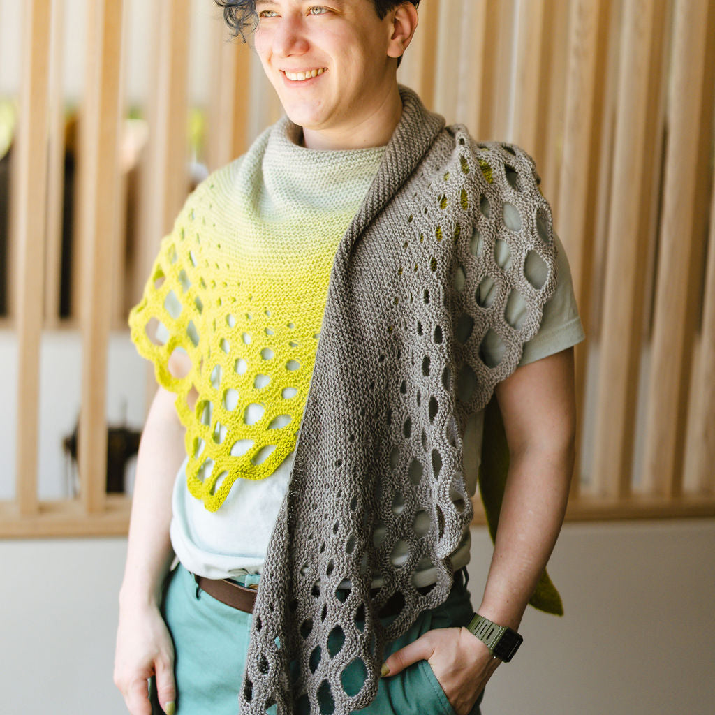 Xandy Peters wearing the Trypophobia Shawl in yellow and grey