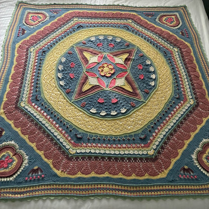 Universe in Bloom Blanket crochet kit – finished blanket in the Gum Blossom colourway, laid flat